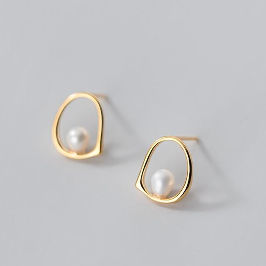 pearl earrings in gold setting