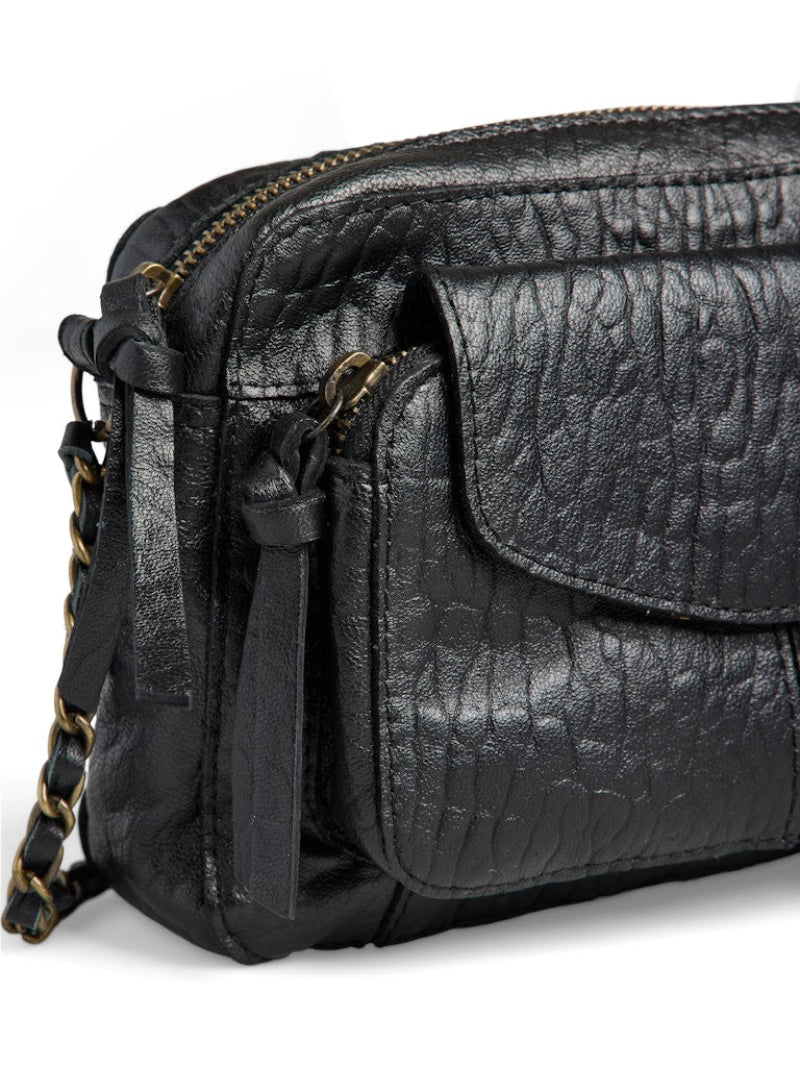 Black leather handbag with a chain detail on a white background