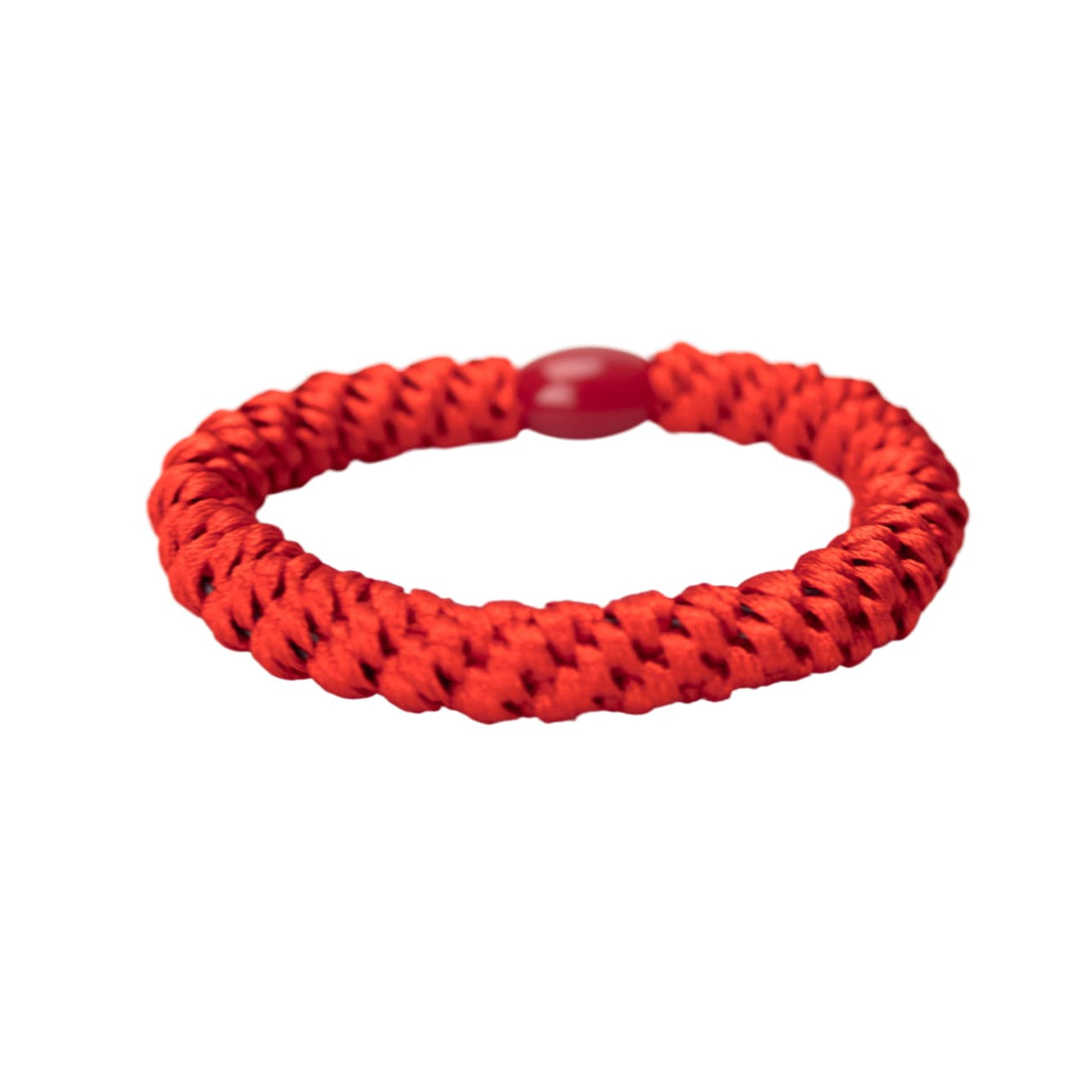 Red braided bracelet on a white background