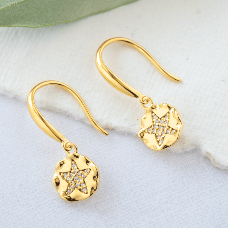 gold star earrings with stones