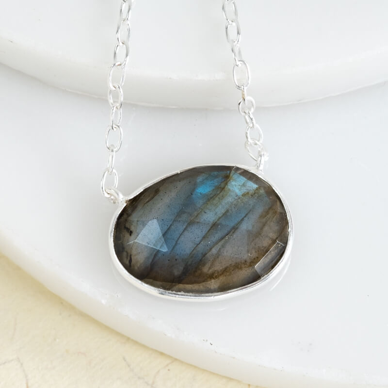 labradorite oval gemstone in silver on a silver chain