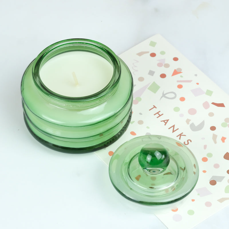 scented candle glass jar green
